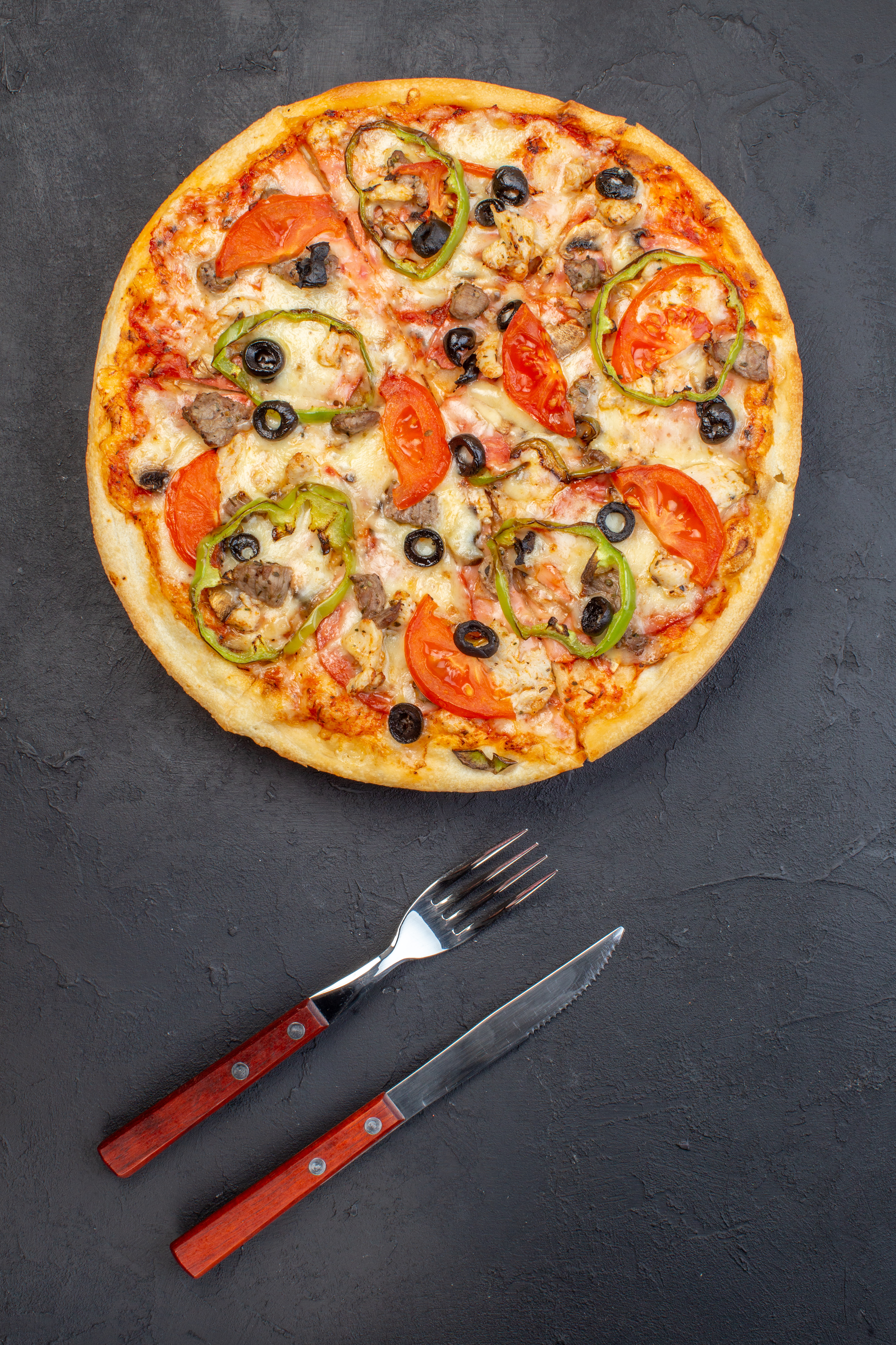 Chef holding pizza slice