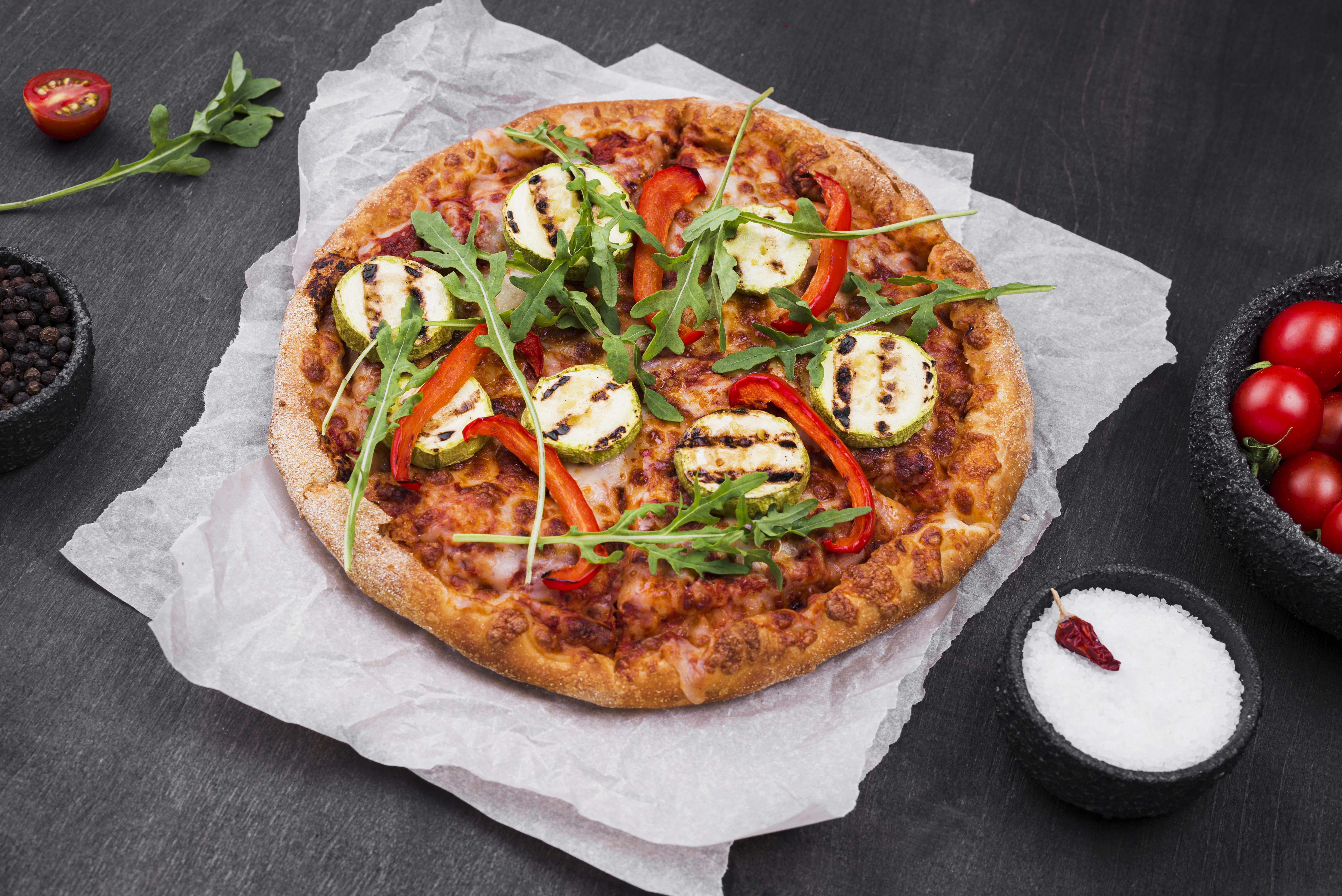 Hands kneading pizza dough